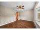 Spacious living room with wood-look tile flooring and plantation shutters, providing plenty of natural light at 37 E 14Th Pl, Broomfield, CO 80020