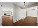 Spacious living room with wood-look floors, and open access to other living areas at 37 E 14Th Pl, Broomfield, CO 80020