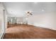 Spacious open-concept living room features tile floors and connects to the kitchen and stairway at 37 E 14Th Pl, Broomfield, CO 80020