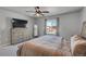 Spacious bedroom with large window, dresser, and comfortable bed at 533 Pioneer Ct, Fort Lupton, CO 80621