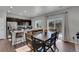 Kitchen with dining table and chairs near sliding glass door at 533 Pioneer Ct, Fort Lupton, CO 80621