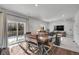 Dining area with wooden table and chairs, and access to backyard at 533 Pioneer Ct, Fort Lupton, CO 80621