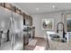 Bright kitchen, featuring stainless steel appliances and granite countertops at 533 Pioneer Ct, Fort Lupton, CO 80621