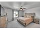 Spacious main bedroom with ceiling fan and large window at 533 Pioneer Ct, Fort Lupton, CO 80621