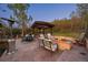 Inviting outdoor patio featuring a fire pit, seating, and pergola, perfect for entertaining at 722 Evening Star Dr, Castle Rock, CO 80108