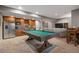 Finished basement area with a billiards table, kitchenette, and comfortable seating area at 722 Evening Star Dr, Castle Rock, CO 80108