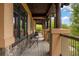 Inviting covered porch with comfortable seating, offering a relaxing outdoor space with scenic views at 722 Evening Star Dr, Castle Rock, CO 80108
