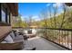 Relaxing outdoor deck with comfortable seating and beautiful wooded views at 722 Evening Star Dr, Castle Rock, CO 80108