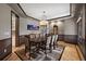 Elegant dining room with tray ceilings, hardwood floors, and stylish decor at 722 Evening Star Dr, Castle Rock, CO 80108