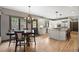 Bright, modern kitchen featuring a granite island, stainless steel appliances, and white cabinetry at 722 Evening Star Dr, Castle Rock, CO 80108