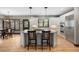 Spacious kitchen with island, stainless steel appliances, stone countertops, and hardwood floors at 722 Evening Star Dr, Castle Rock, CO 80108