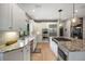 Well-appointed kitchen with custom cabinets, granite countertops, stainless appliances, and center island at 722 Evening Star Dr, Castle Rock, CO 80108