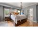 Comfortable primary bedroom features soft lighting, hardwood floors, and modern finishes at 722 Evening Star Dr, Castle Rock, CO 80108