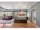 Spacious primary bedroom with a chandelier, sitting area, and large windows at 722 Evening Star Dr, Castle Rock, CO 80108