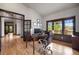 Bright office space with hardwood floors, large windows, and stylish trim at 722 Evening Star Dr, Castle Rock, CO 80108