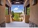 Inviting porch showcasing stunning mountain views, neutral wood beams, stone accents, and a lovely wood floor at 722 Evening Star Dr, Castle Rock, CO 80108