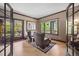 Sitting room features hardwood floors, natural light, and access to a private balcony at 722 Evening Star Dr, Castle Rock, CO 80108