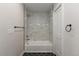 Bathroom featuring a tiled shower and a modern tub at 2253 Kipling St, Lakewood, CO 80215