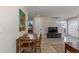 Open dining area with wood table and chairs, adjacent to the living room at 2253 Kipling St, Lakewood, CO 80215