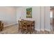 Charming dining area featuring a wooden table set for four at 2253 Kipling St, Lakewood, CO 80215