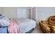 Bedroom with comfortable furniture, including recliner, and ample natural light at 14096 Roaring Fork Cir, Broomfield, CO 80023