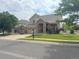 Lovely two-story home with a stone-accented entrance, three-car garage, and neatly manicured lawn at 14096 Roaring Fork Cir, Broomfield, CO 80023