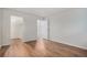 Bright bedroom with hardwood floors, walk-in closet, and neutral paint colors at 10150 E Virginia Ave # 7-304, Denver, CO 80247