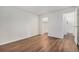 Empty bedroom showcasing the wood-look flooring and open closet space at 10150 E Virginia Ave # 7-304, Denver, CO 80247