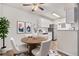 Cozy dining area adjacent to kitchen with modern decor and stainless steel appliances at 10150 E Virginia Ave # 7-304, Denver, CO 80247