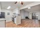 Bright kitchen and living area with wood floors, stainless appliances, and stone fireplace at 10150 E Virginia Ave # 7-304, Denver, CO 80247