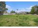 Green recreational area with a playground, picnic gazebo, and American flag, ideal for outdoor activities and relaxation at 10150 E Virginia Ave # 7-304, Denver, CO 80247