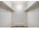 Walk-in closet featuring shelving and hardwood floors at 10150 E Virginia Ave # 7-304, Denver, CO 80247