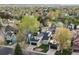 Aerial view of a well-maintained home in a neighborhood with mature trees and green lawns at 11519 Wray Ct, Parker, CO 80134