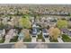 Wide aerial view of a neighborhood with diverse homes, mature trees, and well-kept lawns at 11519 Wray Ct, Parker, CO 80134