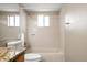 Bathroom featuring a shower-tub combination with a window and a granite vanity at 11519 Wray Ct, Parker, CO 80134