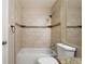 Featuring a shower and tub combination with nice tile work and tiled wall niches at 11519 Wray Ct, Parker, CO 80134