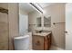 Neutral bathroom featuring a granite vanity with a mirror and a toilet at 11519 Wray Ct, Parker, CO 80134