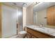 Bathroom featuring a glass shower stall and granite vanity at 11519 Wray Ct, Parker, CO 80134