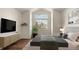 Comfortable bedroom with large windows, tasteful decor, and a serene ambiance for restful nights at 11519 Wray Ct, Parker, CO 80134