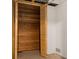 Open cedar closet, showcasing wood paneling, hanging rod, and folding doors at 11519 Wray Ct, Parker, CO 80134