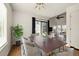 Stylish dining area with modern lighting, seating for six, and opens to living space at 11519 Wray Ct, Parker, CO 80134