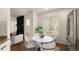 Bright dining area features a marble table, modern chairs and a view of fireplace at 11519 Wray Ct, Parker, CO 80134