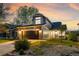 Beautiful two-story home with a two-car garage and well-maintained lawn at sunset at 11519 Wray Ct, Parker, CO 80134