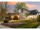 Charming two-story home with manicured front yard, stone accents, and a two-car garage at 11519 Wray Ct, Parker, CO 80134