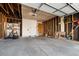Spacious two-car garage awaiting customization with a clean concrete floor and exposed stud framing at 11519 Wray Ct, Parker, CO 80134