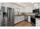 Updated kitchen featuring stainless steel appliances, granite countertops, and white cabinetry at 11519 Wray Ct, Parker, CO 80134