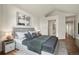 Elegant main bedroom featuring a calming color palette, artwork, and bedside tables with lamps at 11519 Wray Ct, Parker, CO 80134