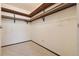 Walk-in closet offers shelving and hanging rods for optimal storage at 9625 E Center Ave # 5C, Denver, CO 80247