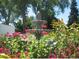 Beautiful fountain surrounded by bright, colorful flowers creating a serene outdoor space at 9625 E Center Ave # 5C, Denver, CO 80247