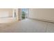 Living room featuring a sliding door to the screened in patio at 9625 E Center Ave # 5C, Denver, CO 80247